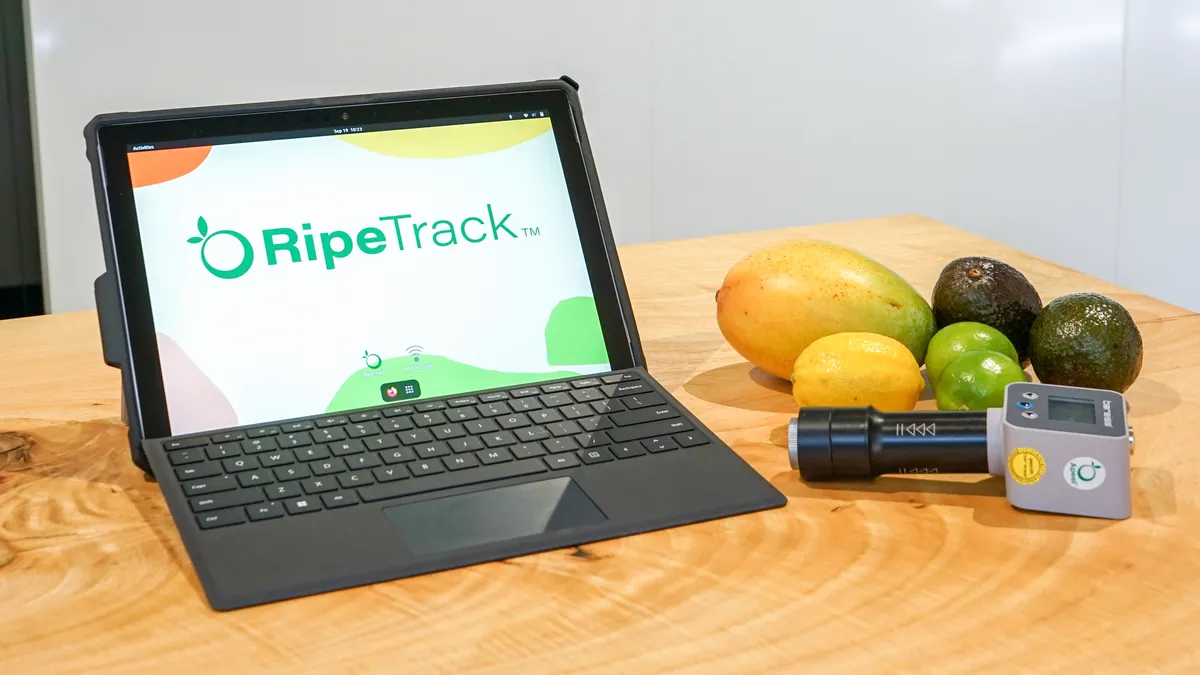 RipTrack device displayed next to laptop