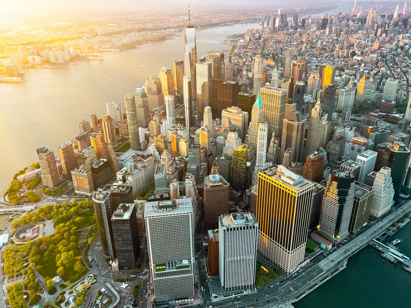 An aerial view of the Manhattan skyline at sunset.