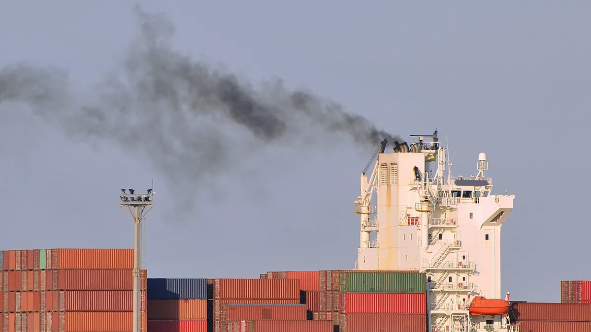 Atmospheric pollution by vessel against a clear sky.