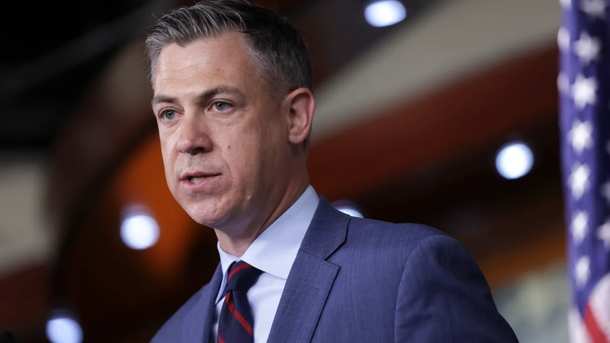 A close-up of a member of congress speaking at the Capitol building