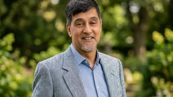 A headshot of Kabir Nath, CEO of Compass Pathways.