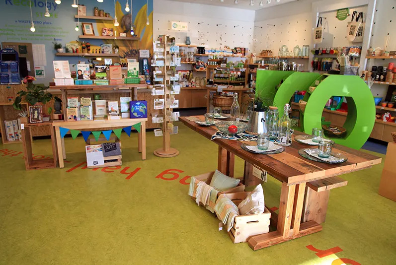 A brightly colored store with reusable and refillable products