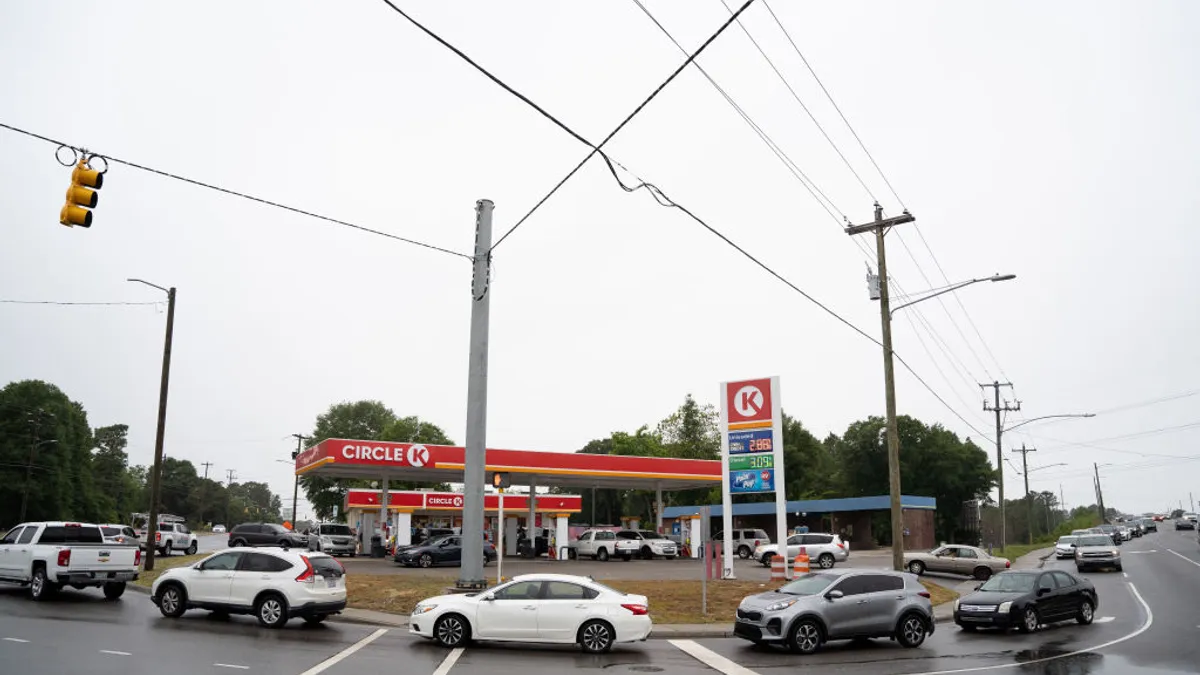 Motorists wait in line in the road and across a nearby overpass at a Circle K gas station on May 12, 2021 in Fayetteville, North Carolina.