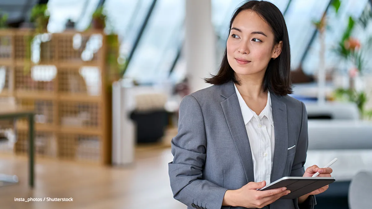 Corporate young lady using a tab