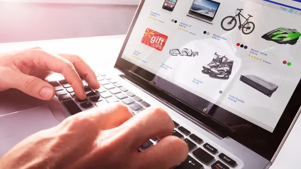 A person looking at product listings on a computer.