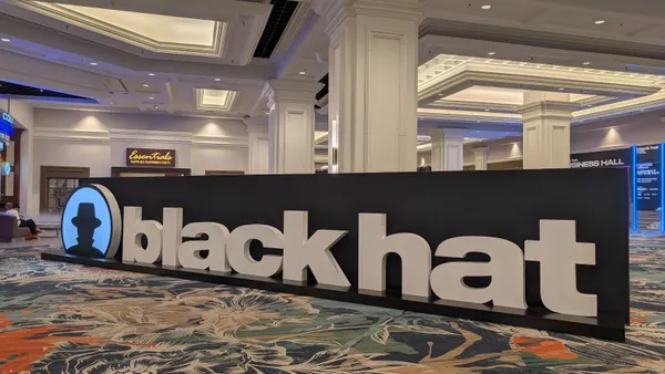 Oversized letters in a convention center spell out the words "Black Hat"