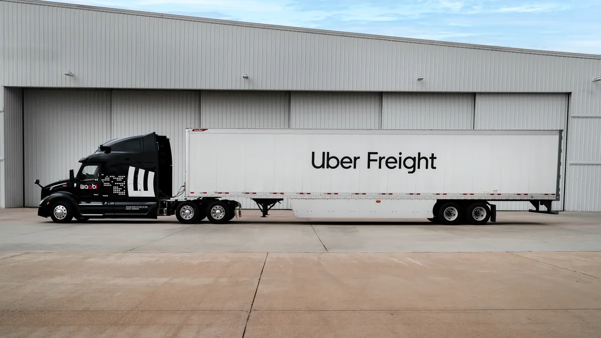 An Uber Freight-branded trailer is hooked to a Waabi autonomous truck.