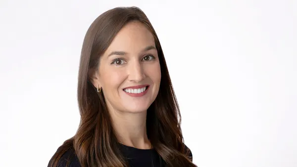 A professional headshot of Caitlin Gossens.