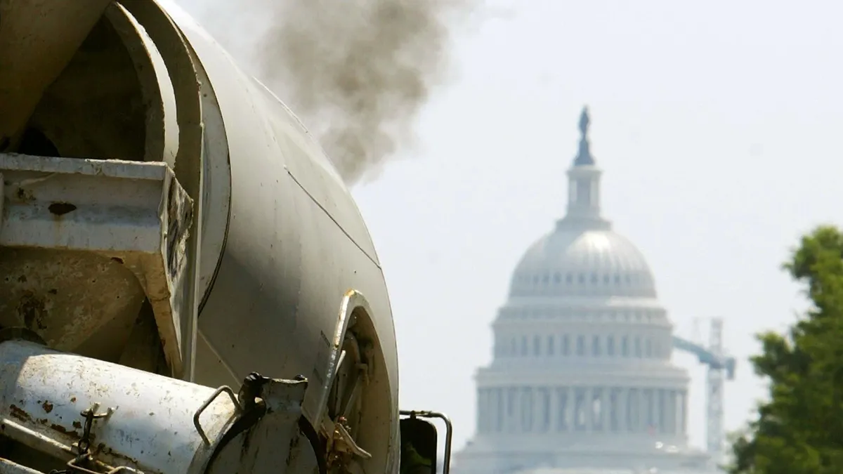 Black smoke from a truck's exhaust is shown near the U.S. Capitol in Washington, DC.