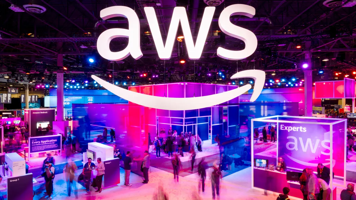 Attendees walk through an expo hall at AWS re:Invent 2023, a conference hosted by Amazon Web Services, at The Venetian Las Vegas on November 28, 2023 in Las Vegas, Nevada.