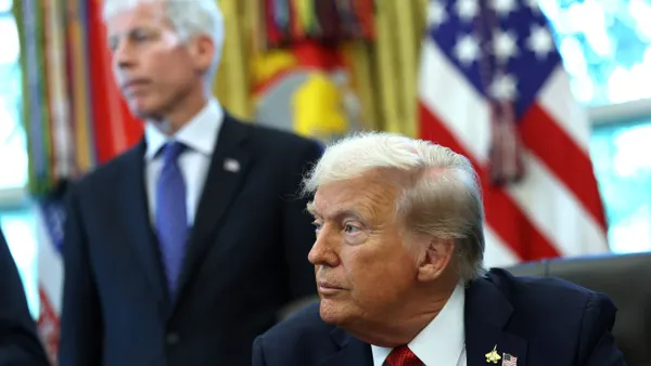President Donald Trump, joined by Energy Secretary Chris Wright, speaks during an event in the Oval Office at the White House.