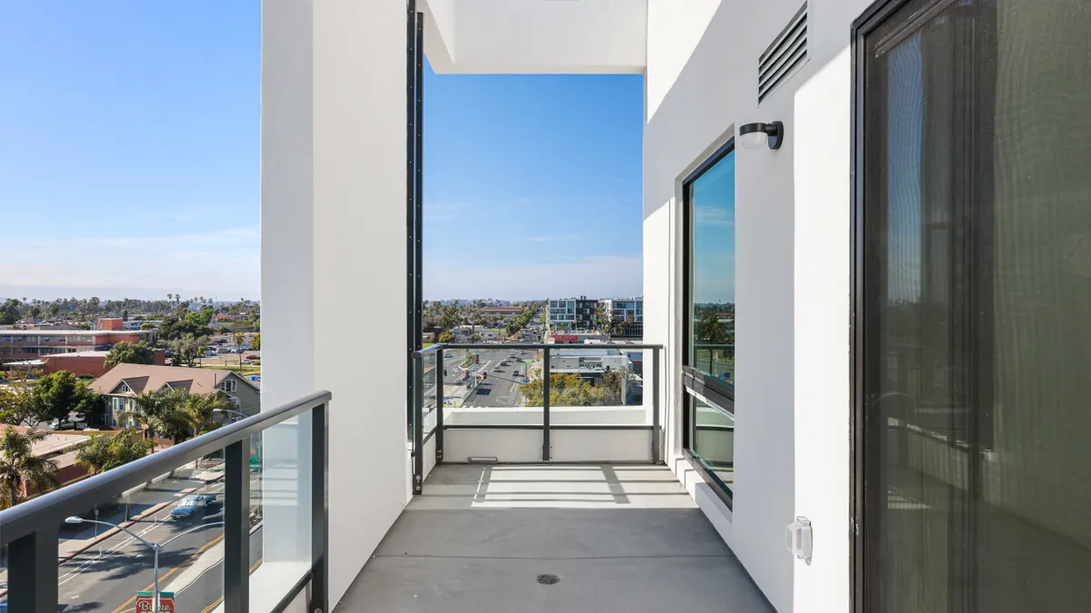 A white stone apartment balcony.