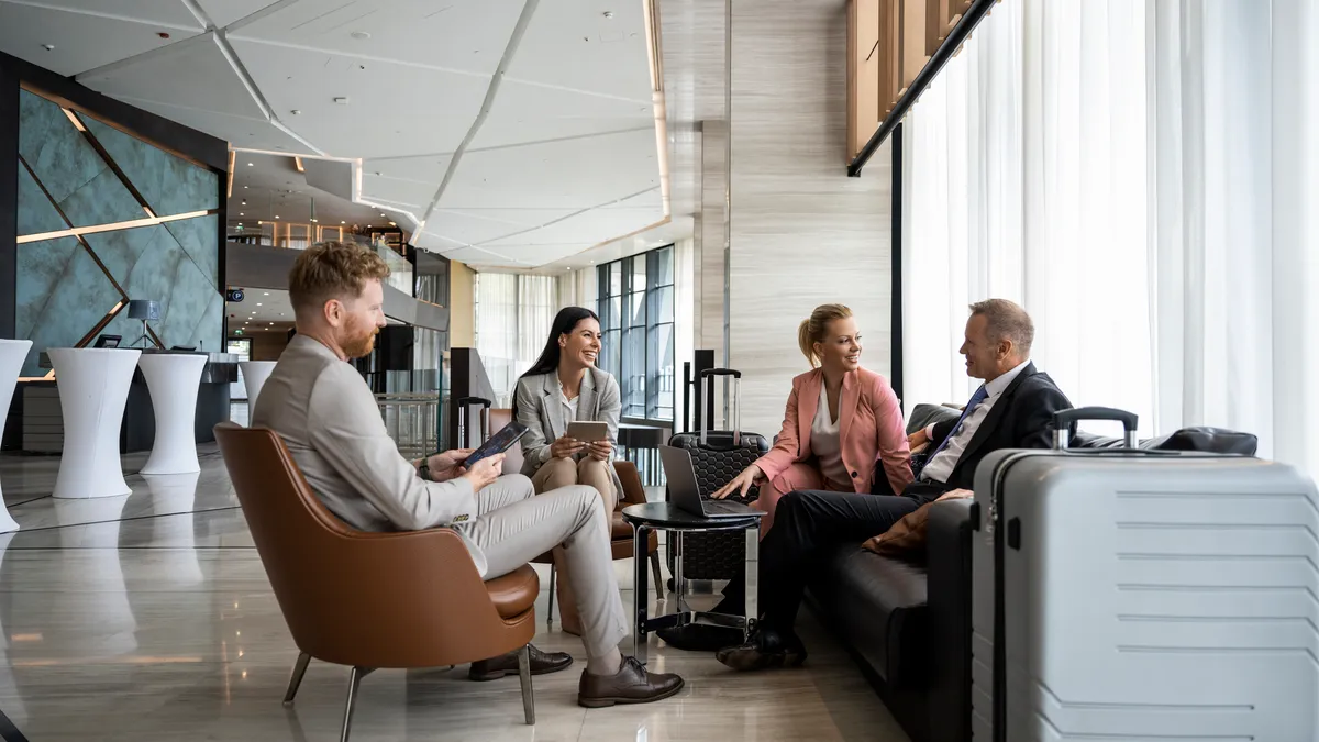 People sitting in hotel lobby