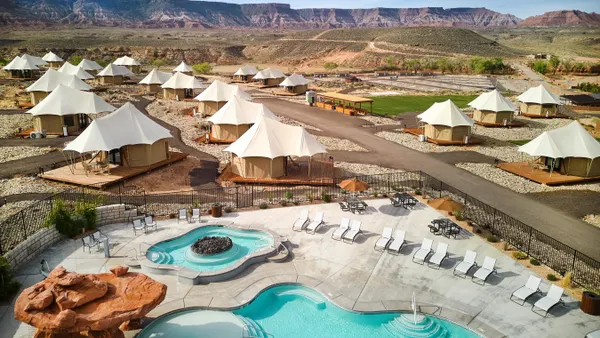 Picture of glamping accommodations alongside pools
