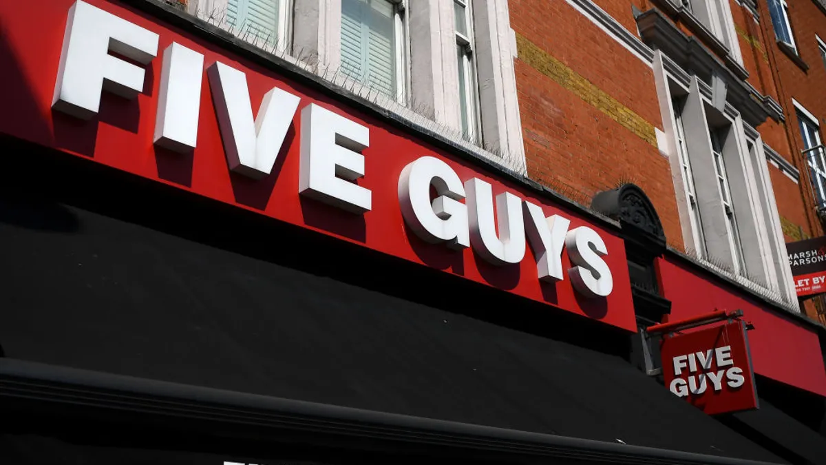 A Five Guys restaurant is pictured in London, England on May 7, 2020. The company confirmed a data breach last September in a series of consumer notification letters issued Dec. 29, 2022.