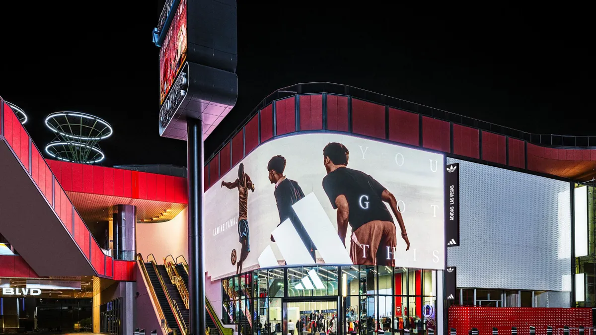 A corner Adidas store with a tall screen featuring the words "You Got This."