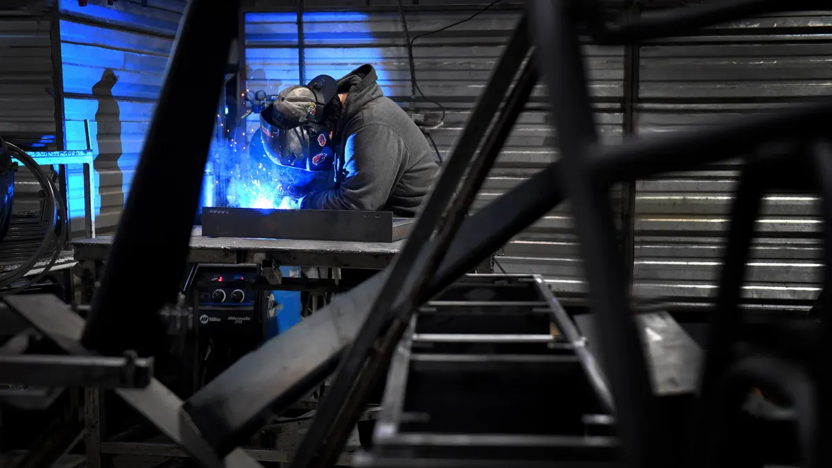 A person wearing a helmet while welding