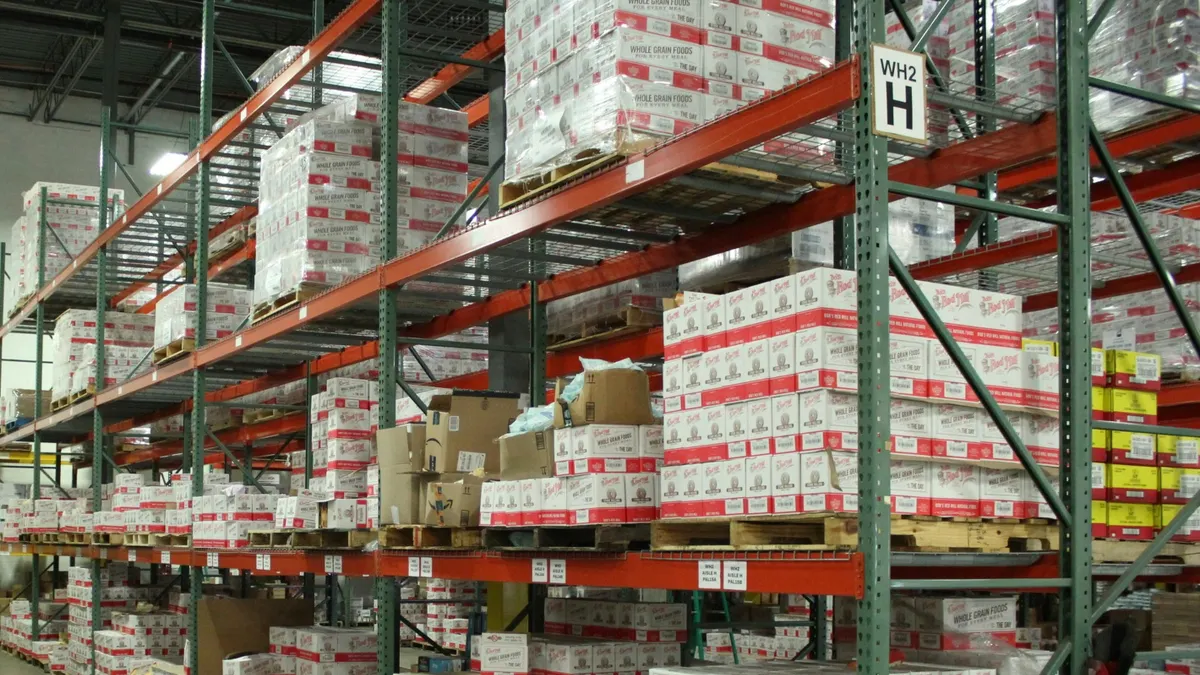 white and red cardboard boxes on shelf
