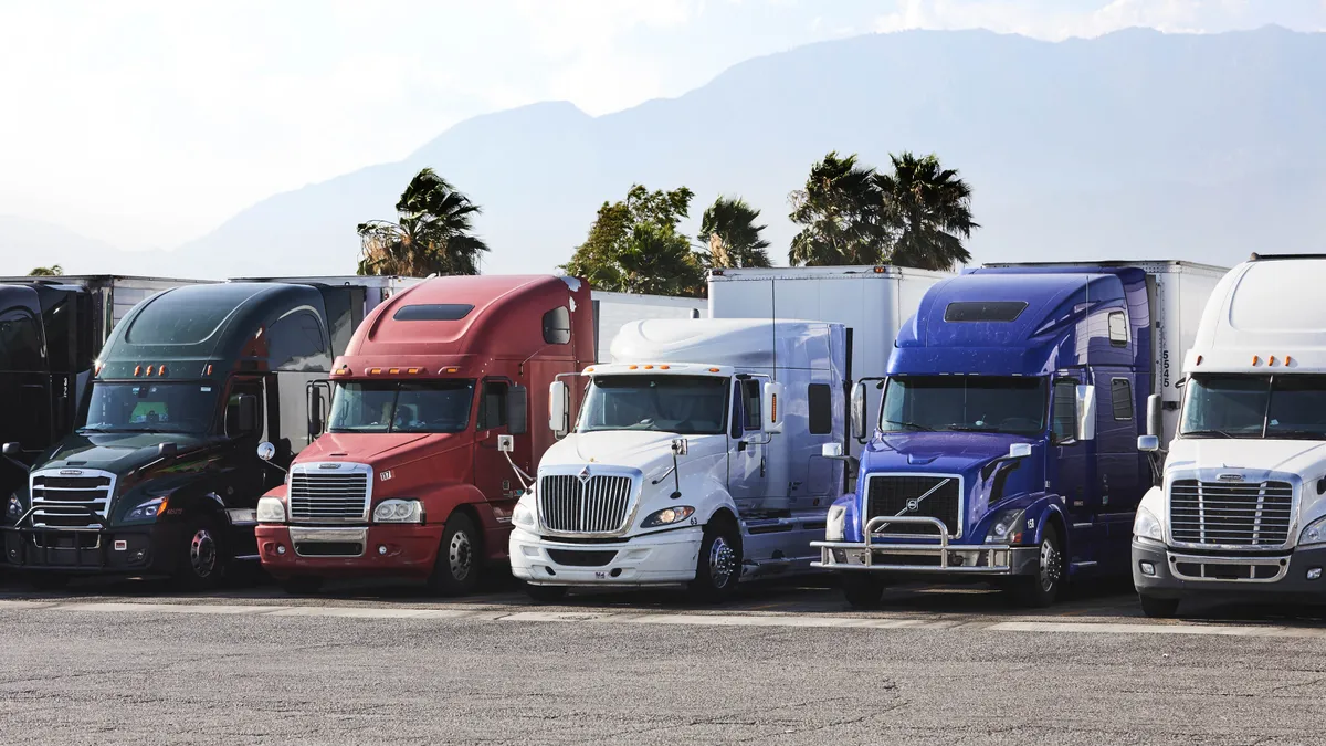 Trucks parked in a lot.