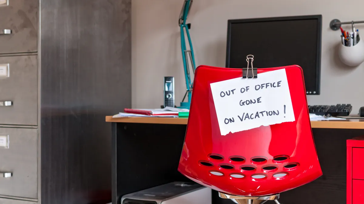 Employee leaves note on back of office chair: "Out of Office. Gone on Vacation!"