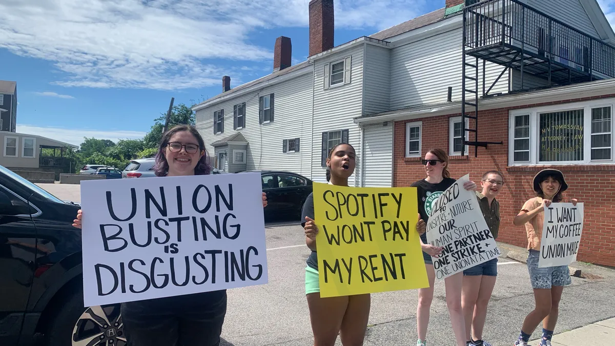 Starbucks Workers United members picket outside a Starbucks in Watertown, Ma., on August 1, 2022.