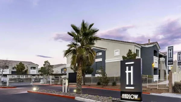 Entrance to apartment building with Harlow sign