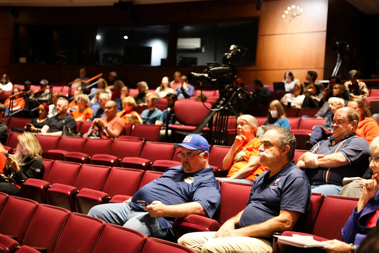 Representatives from local labor unions sit in the audience of an Oct. 9, 2026, local hearing about the proposed merger between Dominion Energy and NextEra.