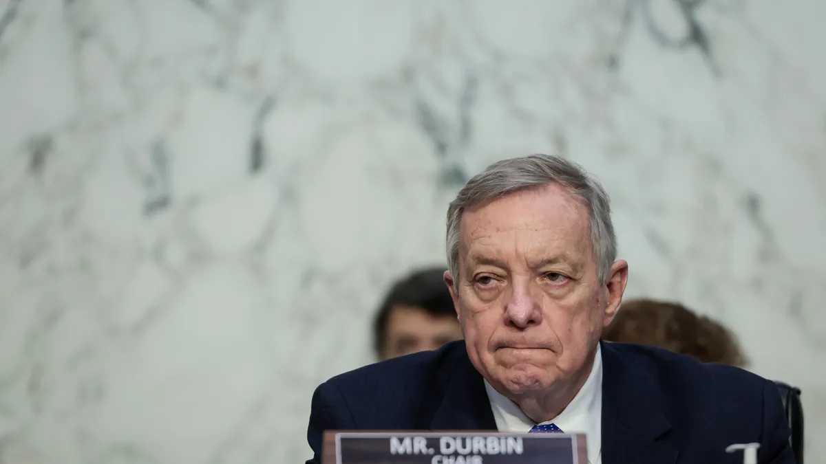 Sen. Durbin grimaces at committee meeting.