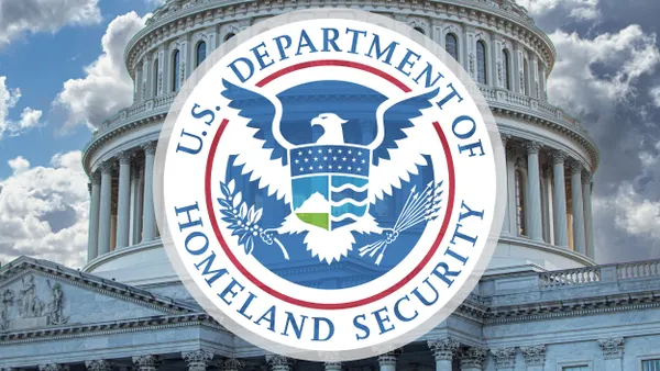Round logo that says U.S. Department of Homeland Security against backdrop of U.S. Capitol