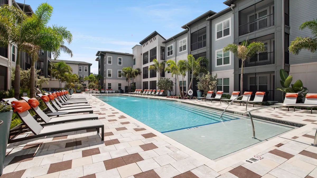 An outdoor pool and lounge area.