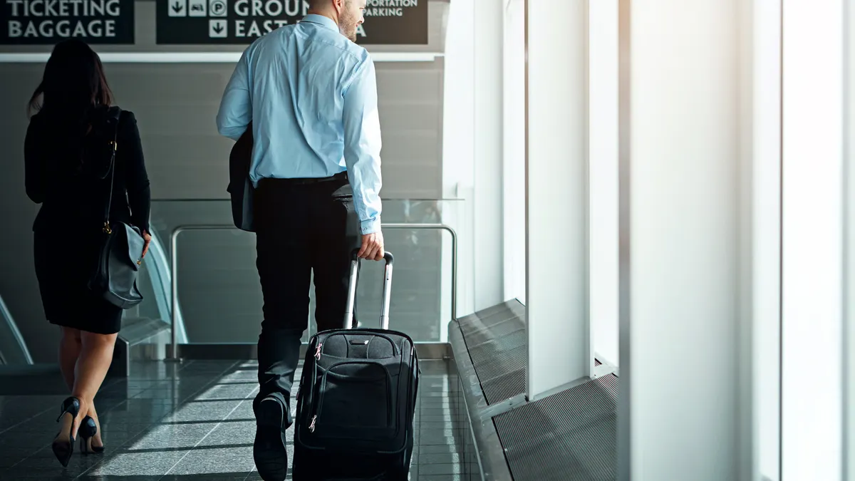 Travel, suitcase or luggage with business man in airport walking to gate