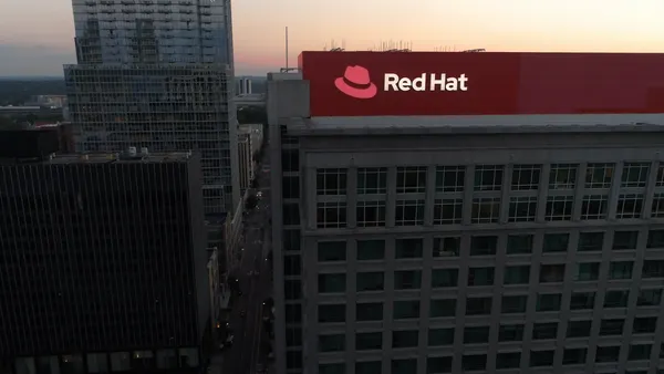 A corporate building in North Carolina with Red Hat signage atop it