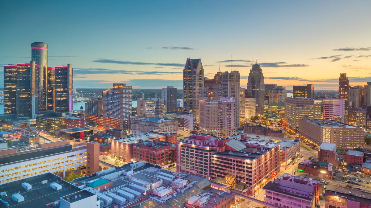 Detroit, Michigan, USA downtown skyline from above at dusk.