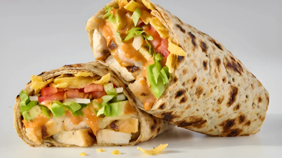 A close up image of a wrap with chicken.