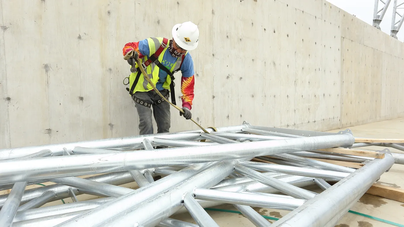 AGC image library construction worker with steel