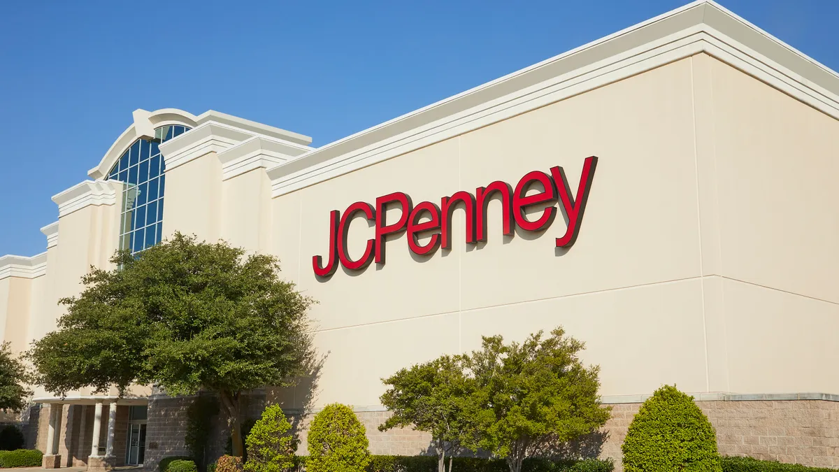 A cream-colored J.C. Penney storefront with signage in red letters.