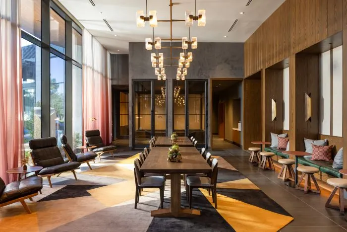a dark paneled dining area in a luxury apartment building