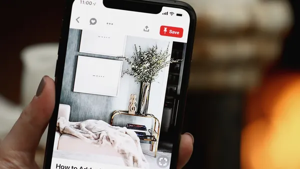 A Pinterest app user browsing home decor on their smartphone