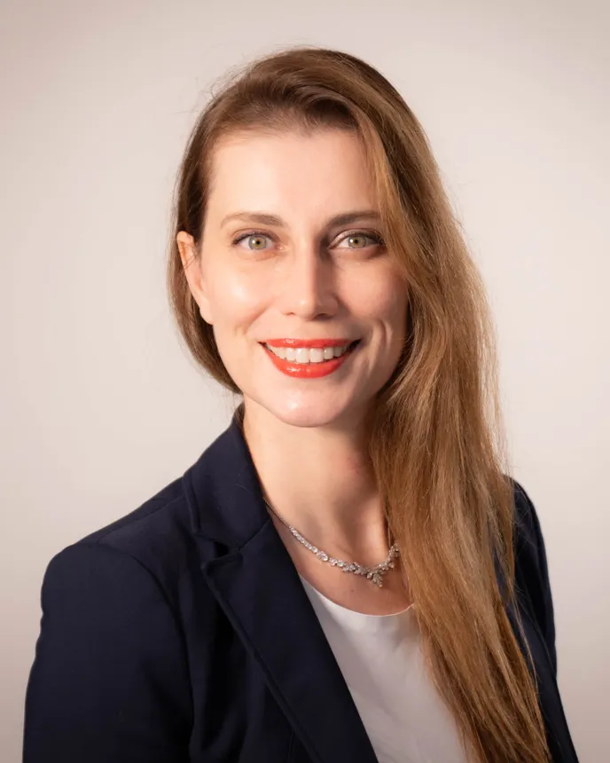 Headshot of a woman in business attire.