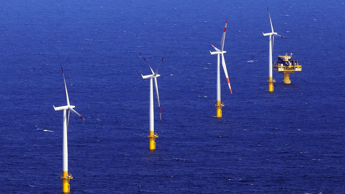 Offshore wind turbines in the ocean.