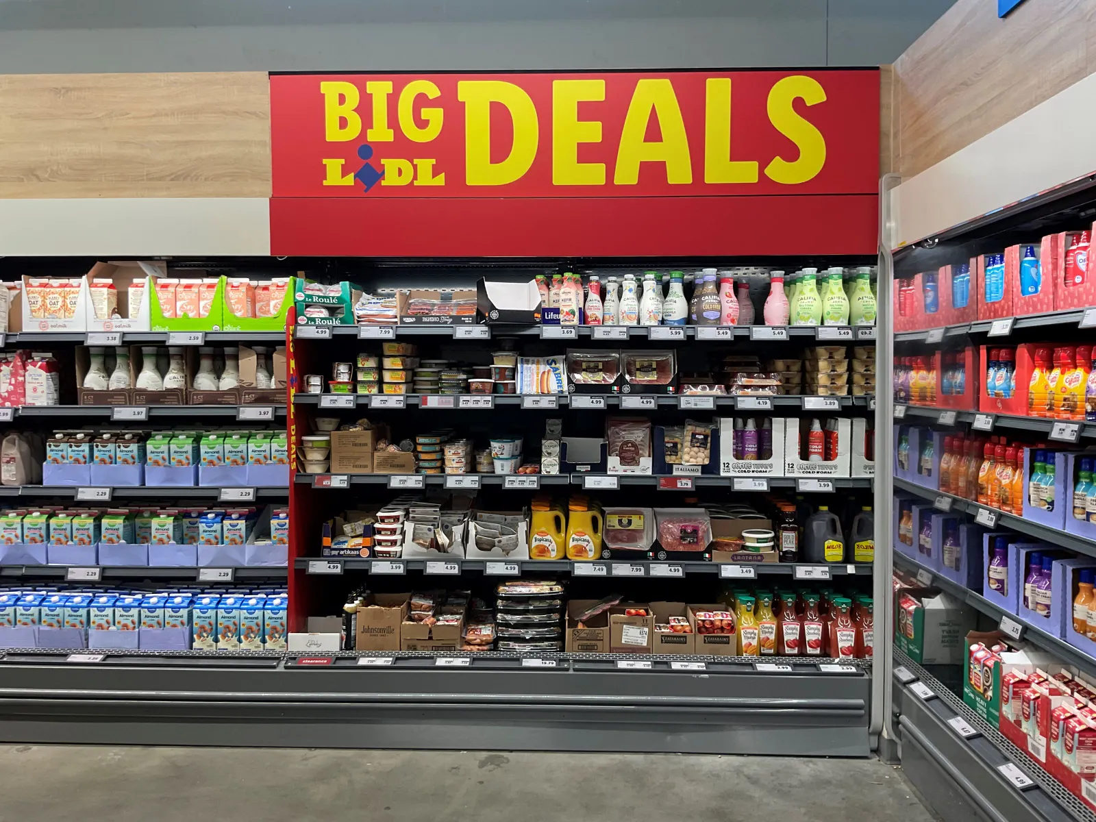 Supermarket shelves with a sign reading "Big Lidl Deals" at the top.