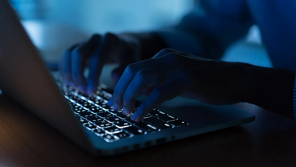 close up programmer man hand typing on keyboard laptop for register data system or access password at dark operation room , cyber security concept - stock photo