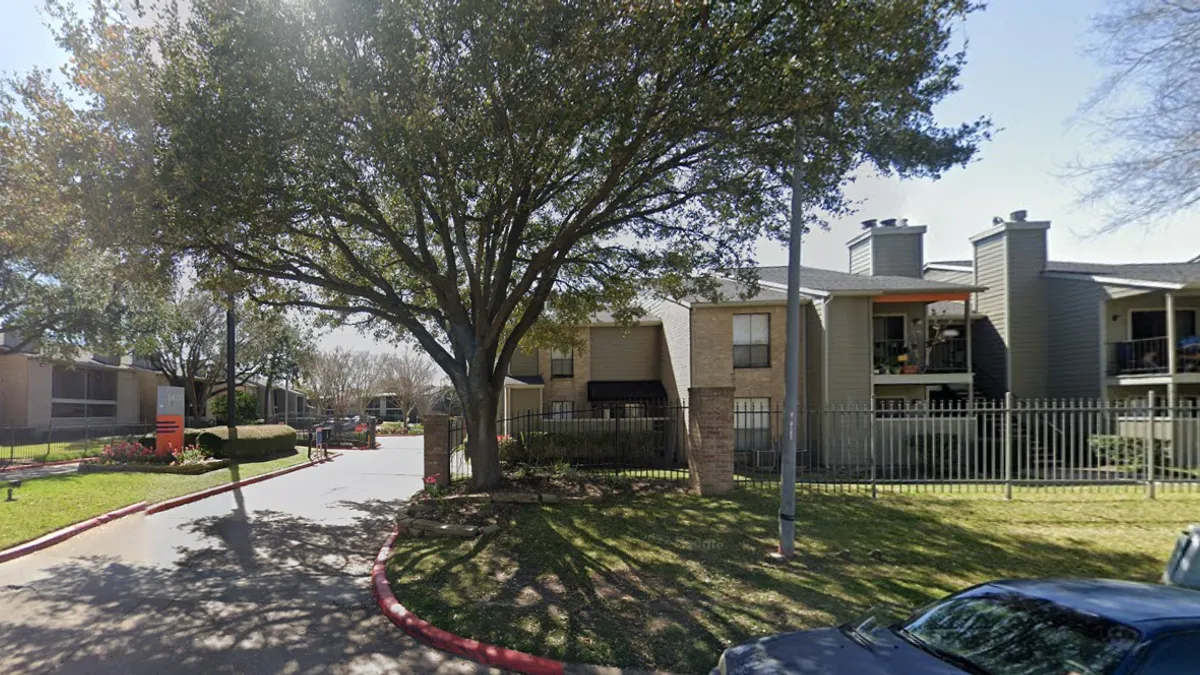 A set of garden-style apartment buildings.