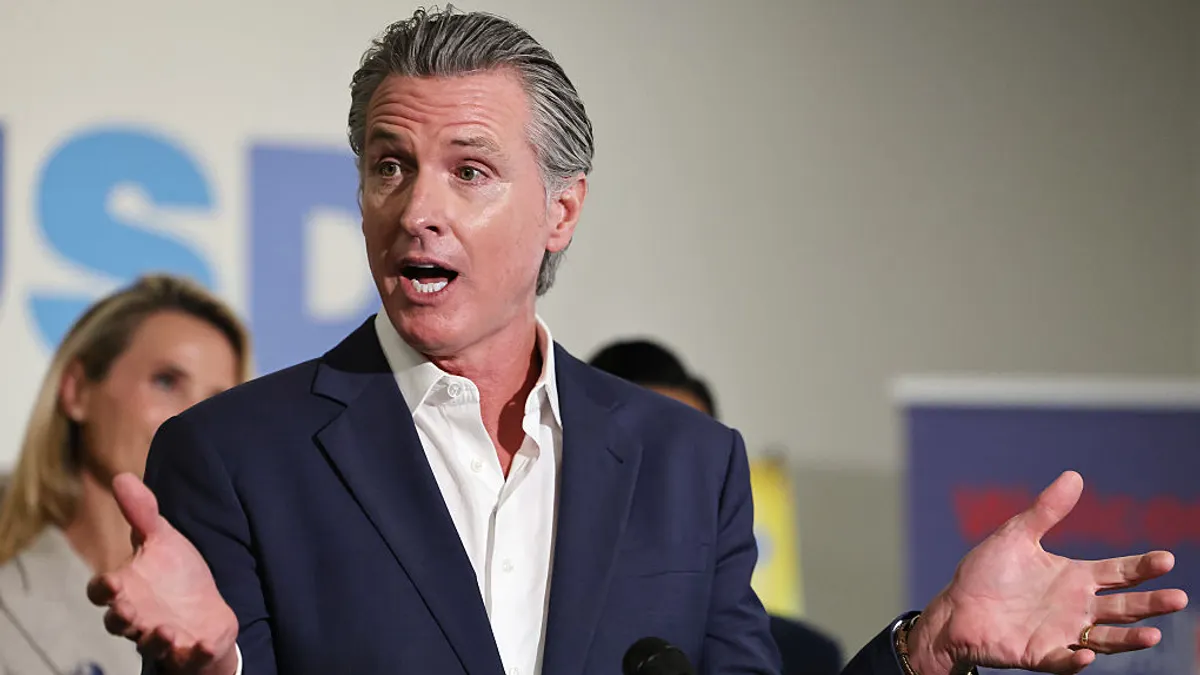 Up close shot of Gavin Newsom while speaking at an event.