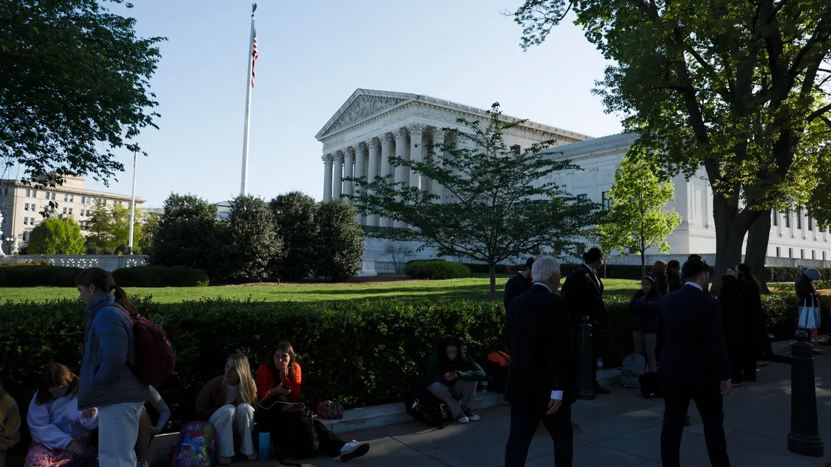 People waiting in line are seen in front of the U.S. Supreme Court.