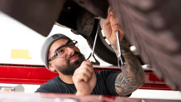 Under a vehicle at Ford's Electric Vehicle Development Center in Long Beach, California