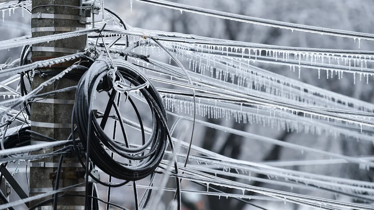 Electricity cables covered in ice after frozen rain phenomenon