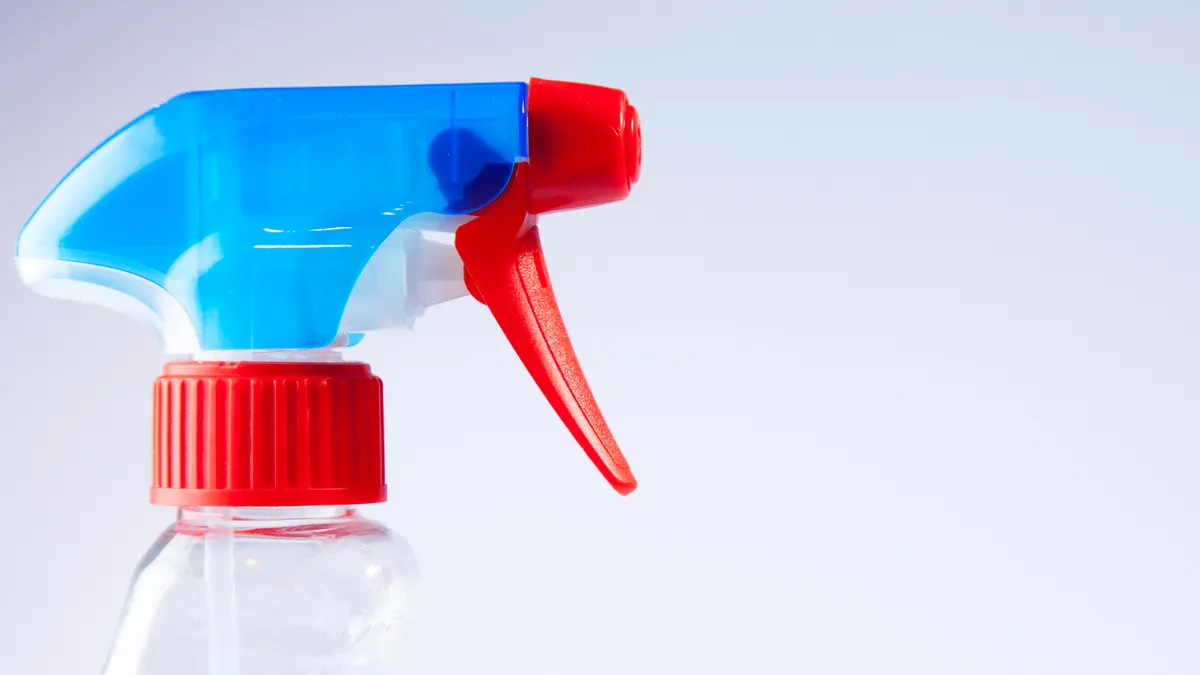 Blue and red spray bottle