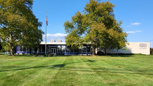 The exterior of a corporate building is labeled as belonging to packaging manufacturer Sonoco.
