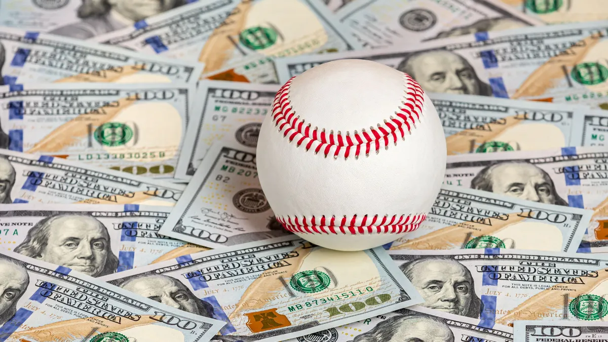 Baseball atop cash; sports betting conceptual image